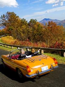 A convertible drives along the Blue Ridge Parkway in Virginia, USA.