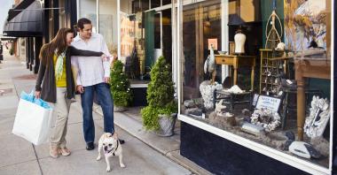 Two people window shopping along Main Street in Farmville, Virginia.