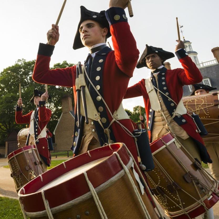 Fifers and drummers in colonial costume perform in front of the Governor's Palace in Williamsburg, Virginia, USA