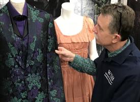 A man browsing vintage clothing